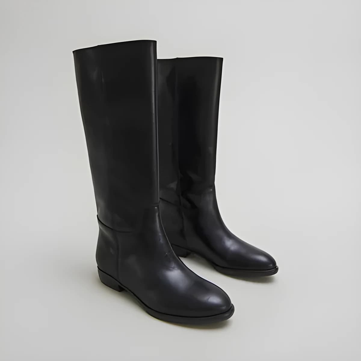 Bottes plates en cuir noir